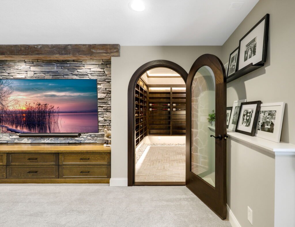 living room with an entrance to a brown wine cellar